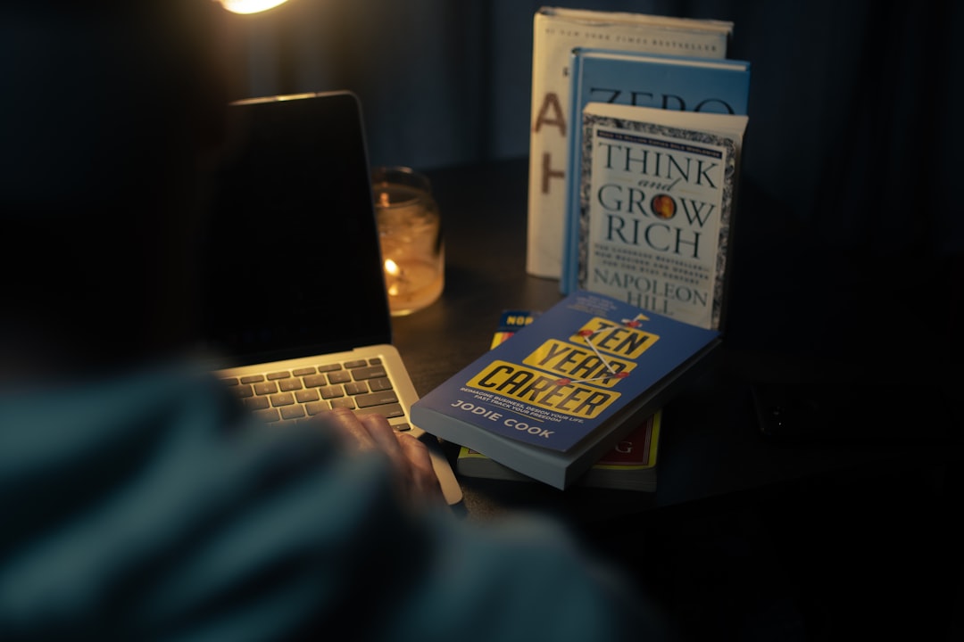 a-laptop-computer-sitting-on-top-of-a-desk-qk2fnwlddgu